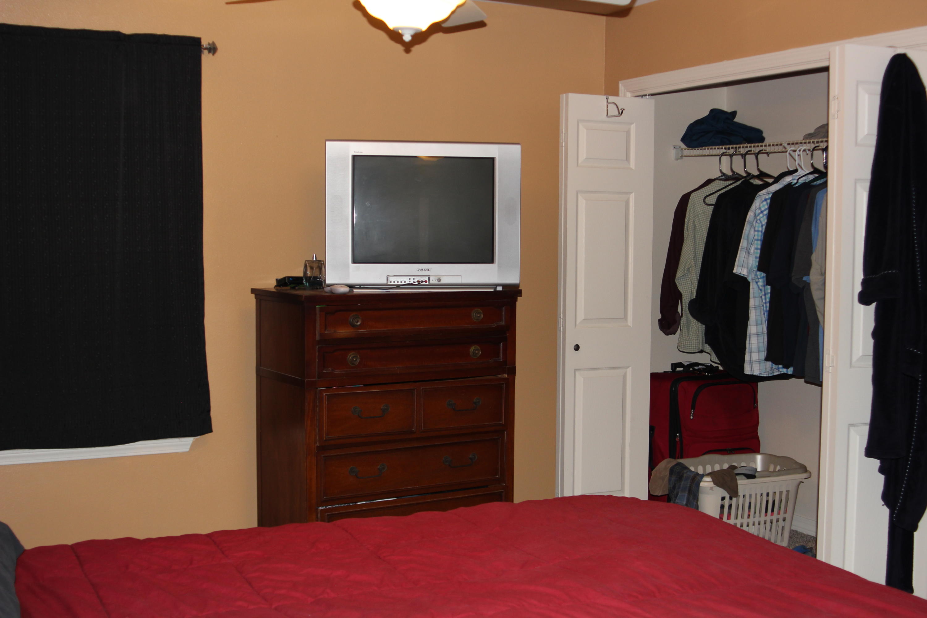 85 Indian Woman Road Santa Rosa Beach, FL 32459 - Photo 27 of 44 a bedroom with a bed and a flat tv screen on dresser