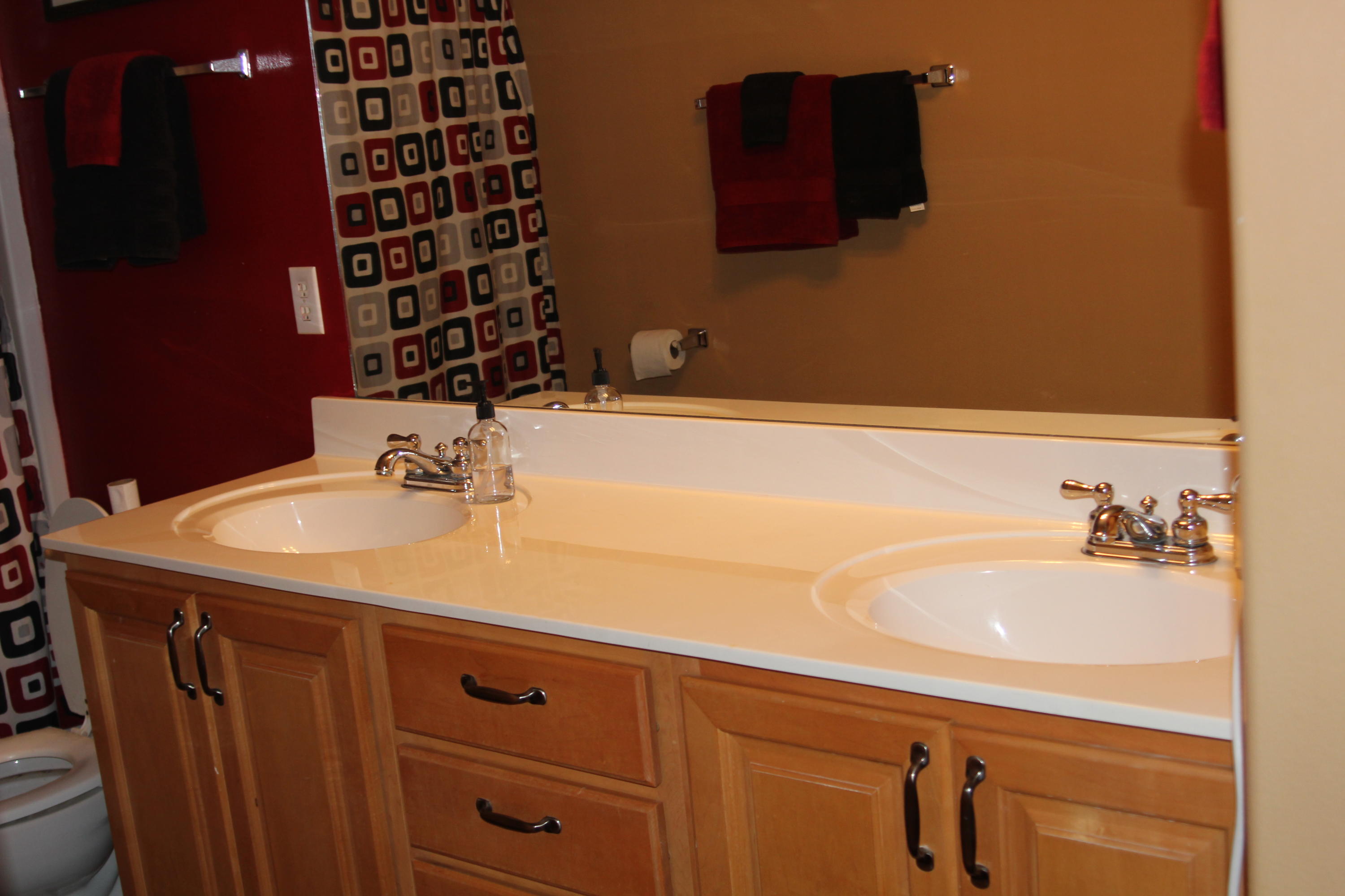 85 Indian Woman Road Santa Rosa Beach, FL 32459 - Photo 34 of 44 a bathroom with a sink and a mirror