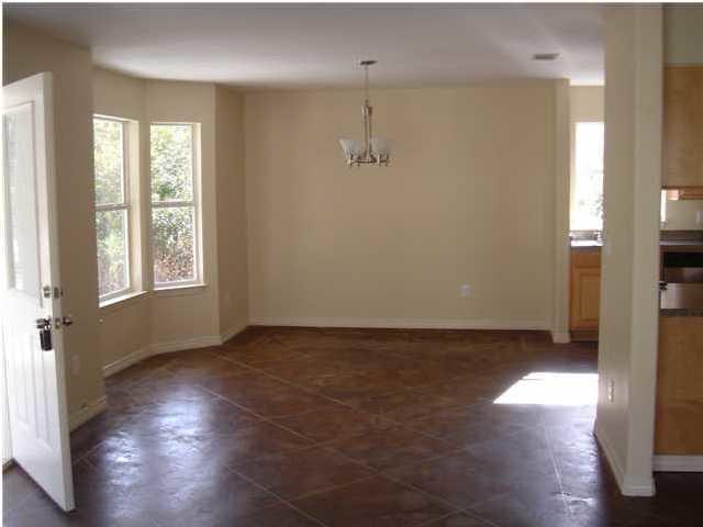 85 Indian Woman Road Santa Rosa Beach, FL 32459 - Photo 5 of 44 a view of an empty room with wooden floor and a window