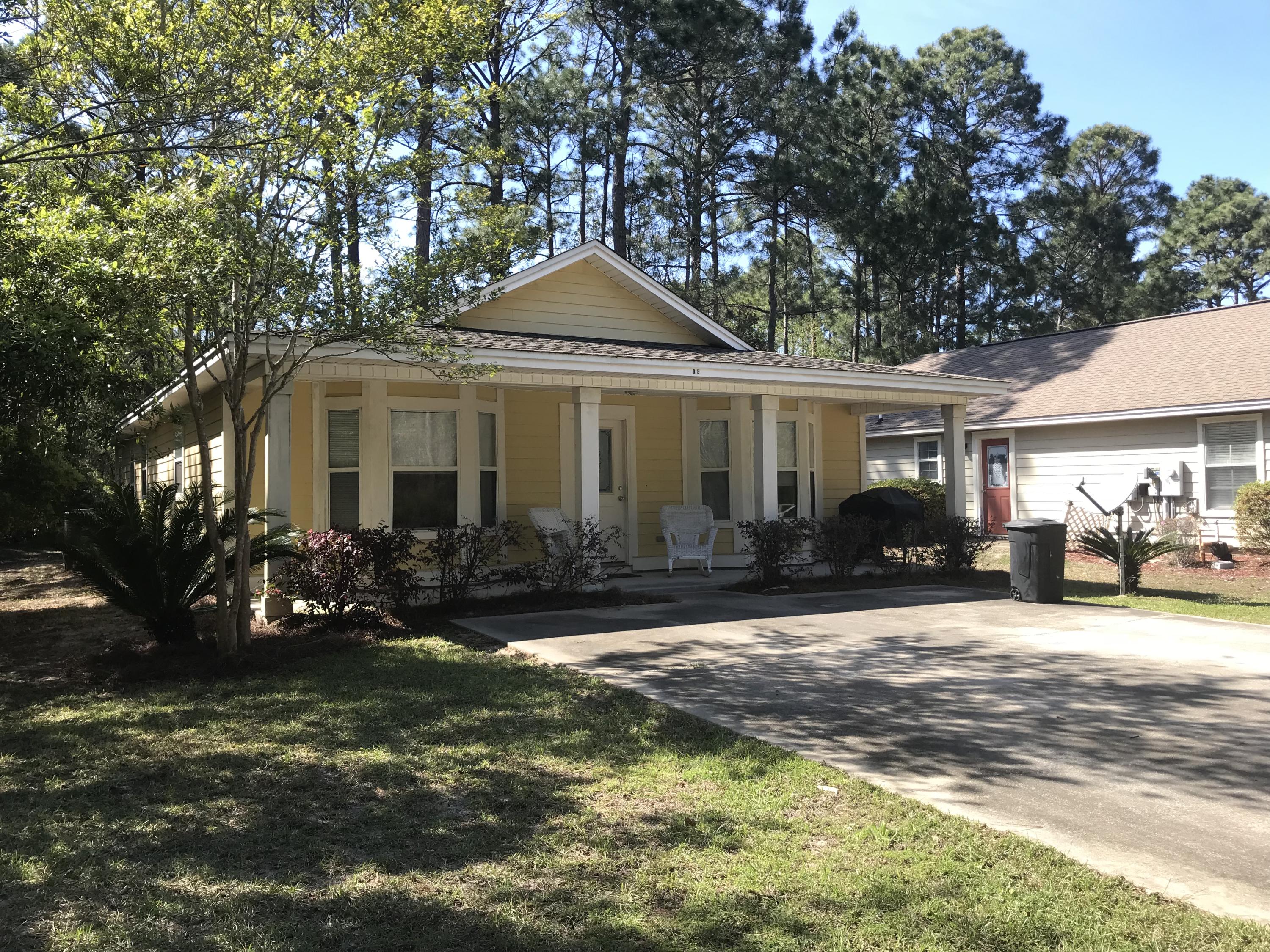 85 Indian Woman Road Santa Rosa Beach, FL 32459 - Photo 41 of 44 a front view of a house with a yard