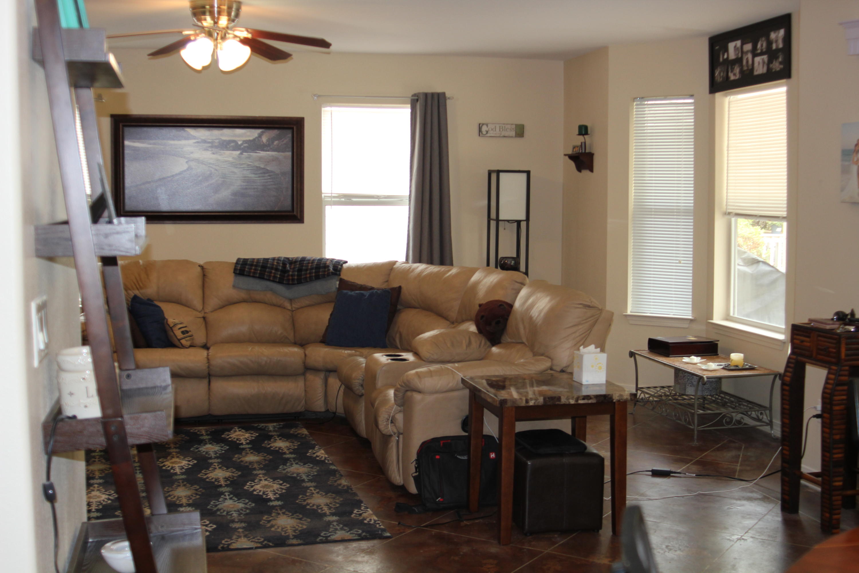 85 Indian Woman Road Santa Rosa Beach, FL 32459 - Photo 9 of 44 a living room with furniture a chandelier and a window