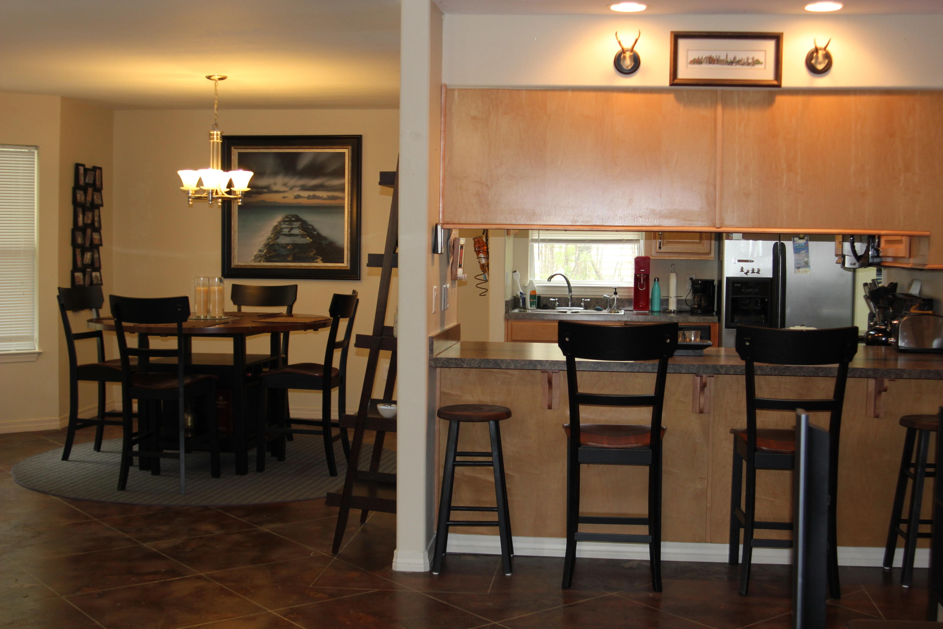 85 Indian Woman Road Santa Rosa Beach, FL 32459 - Photo 10 of 44 a view of a dining room with furniture and wooden floor