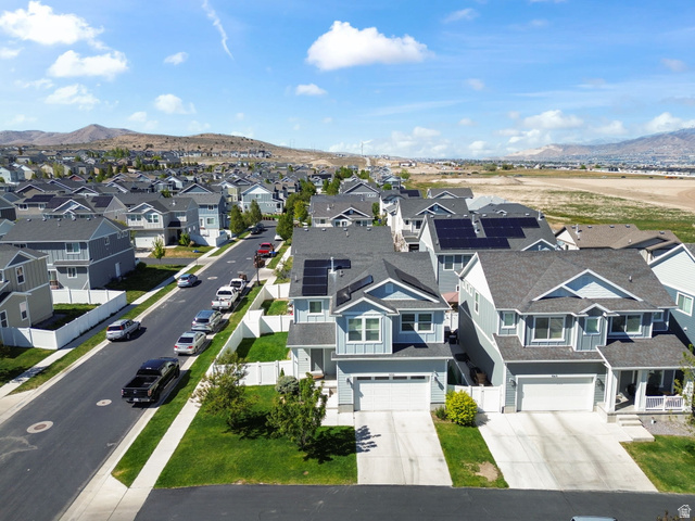 5155 East Rio Grande Way Eagle Mountain, UT 84005 - Photo 37 of 40 Aerial perspective of suburban area featuring a mountainous background