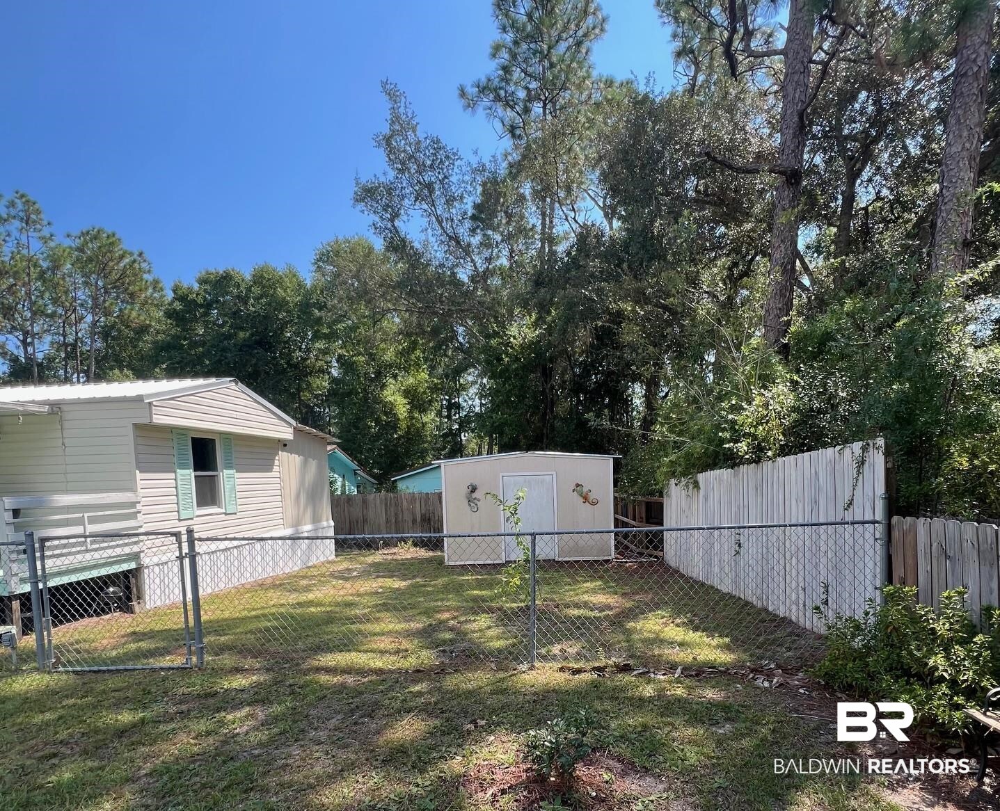 1420 Ridgewood Circle Lillian, AL 36549 - Photo 20 of 41 View of yard with a storage unit