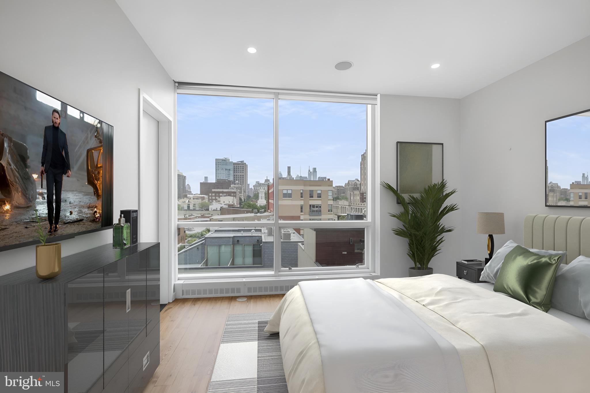 101 Walnut Street, Unit 6 Philadelphia, PA 19106 - Photo 13 of 21 a bedroom with a large bed and a large window