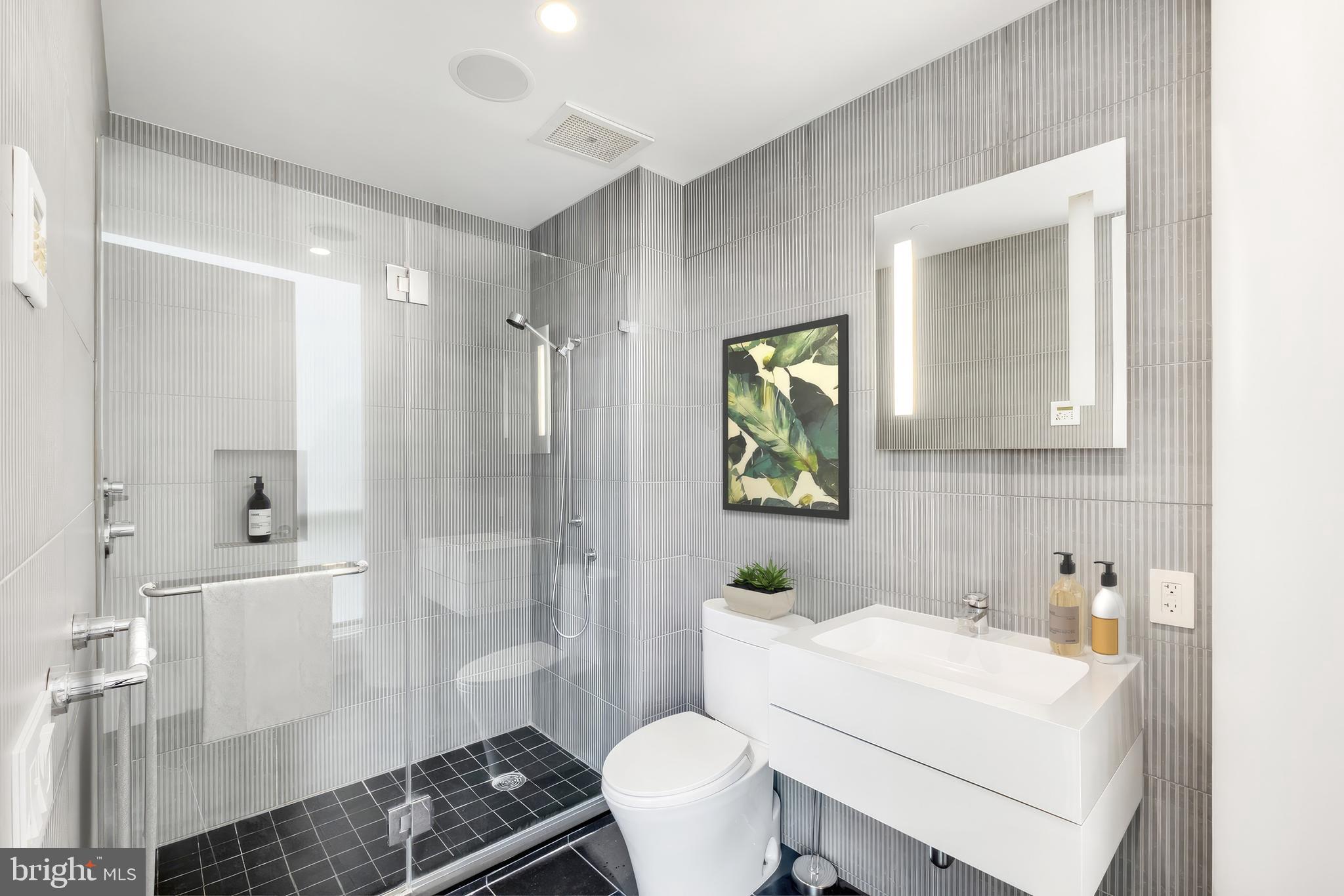 101 Walnut Street, Unit 6 Philadelphia, PA 19106 - Photo 14 of 21 a bathroom with a sink toilet and shower