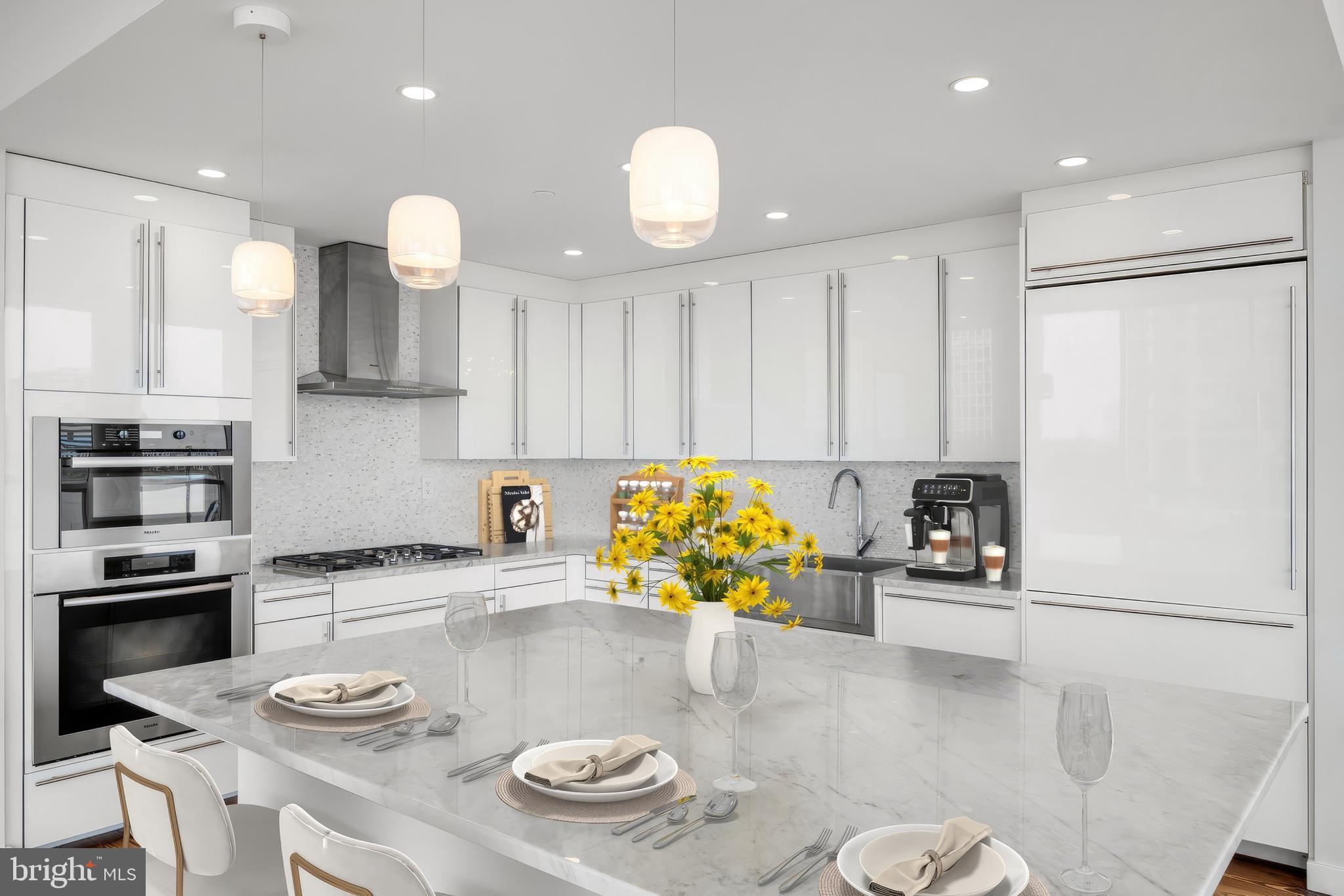 101 Walnut Street, Unit 6 Philadelphia, PA 19106 - Photo 4 of 21 a kitchen with stainless steel appliances granite countertop a sink and a stove