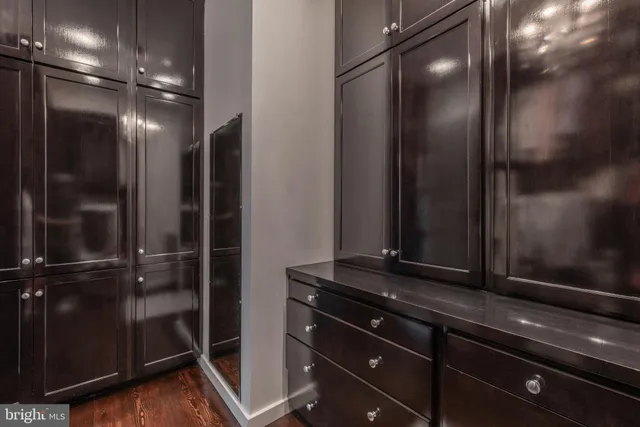 a bathroom with a mirror and a shower