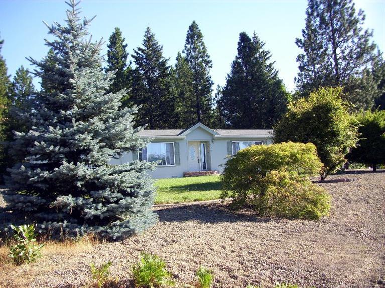 5075 West Side Road Cave Junction, OR 97523 - Photo 2 of 22 front of home from circular driveway