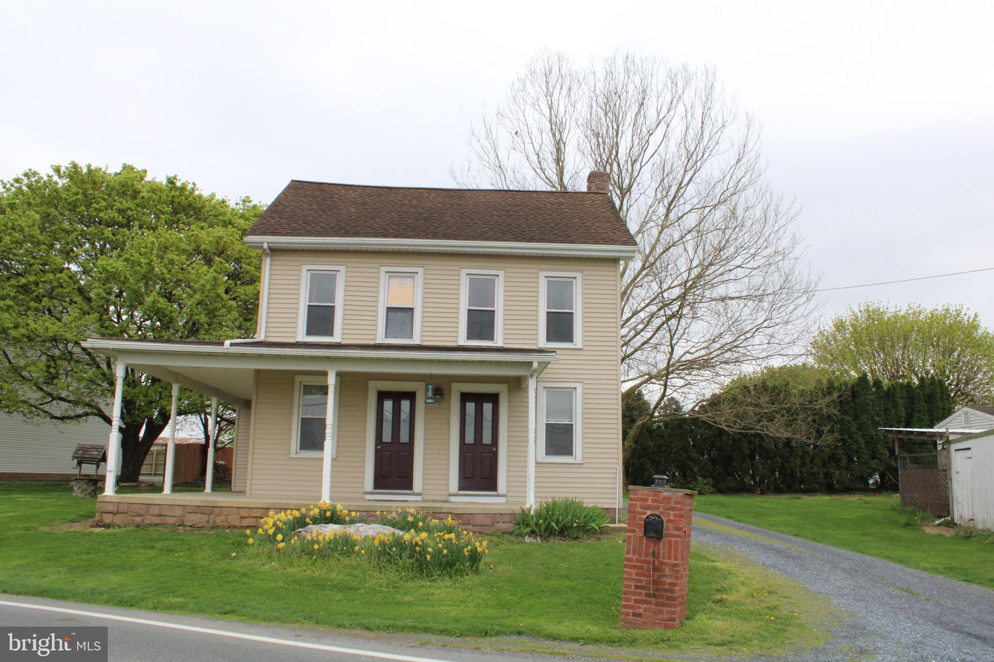 165 Short Road Stevens, PA 17578 - Photo 1 of 19 a front view of a house with a yard and trees