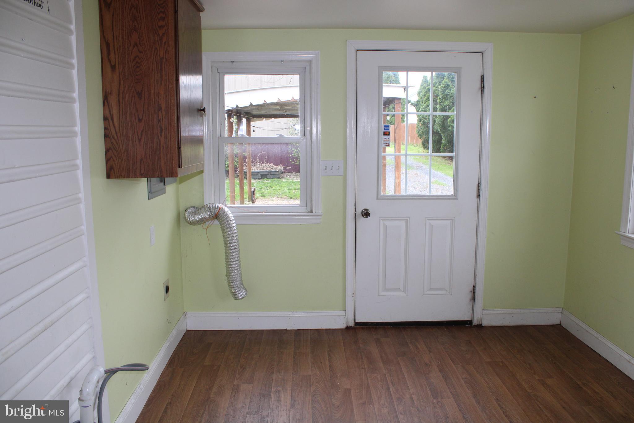 165 Short Road Stevens, PA 17578 - Photo 13 of 19 an empty room with wooden floor and windows