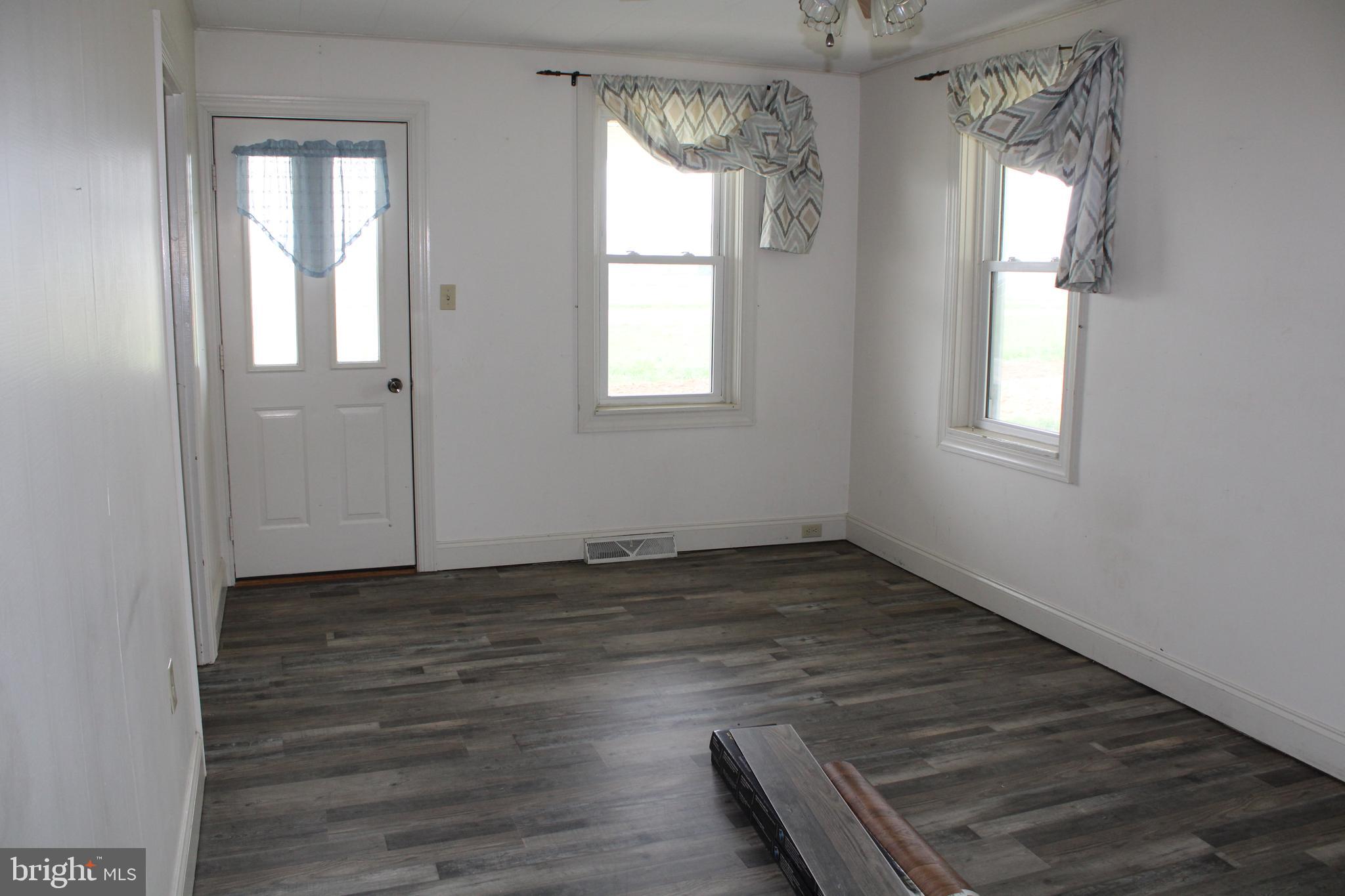 165 Short Road Stevens, PA 17578 - Photo 14 of 19 an empty room with wooden floor and windows