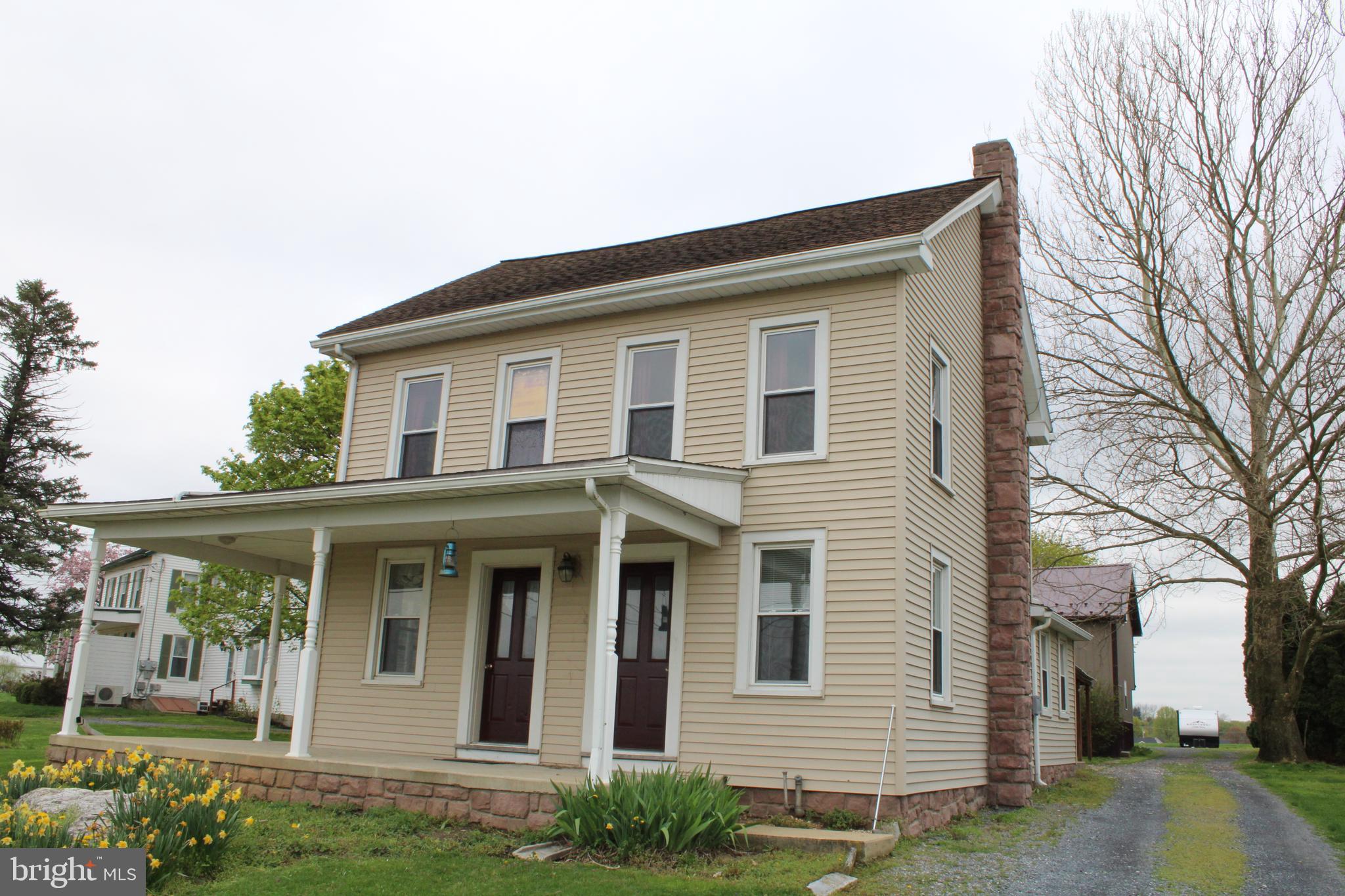 165 Short Road Stevens, PA 17578 - Photo 2 of 19 a front view of a house with garden