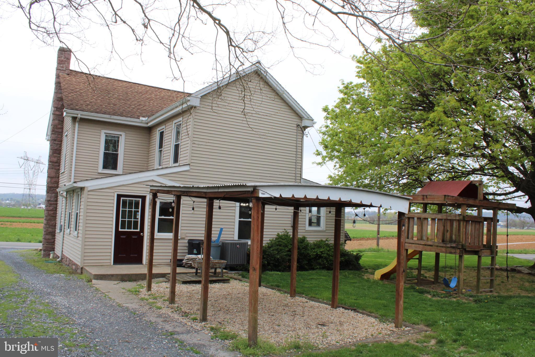 165 Short Road Stevens, PA 17578 - Photo 3 of 19 a patio with a yard table and chairs
