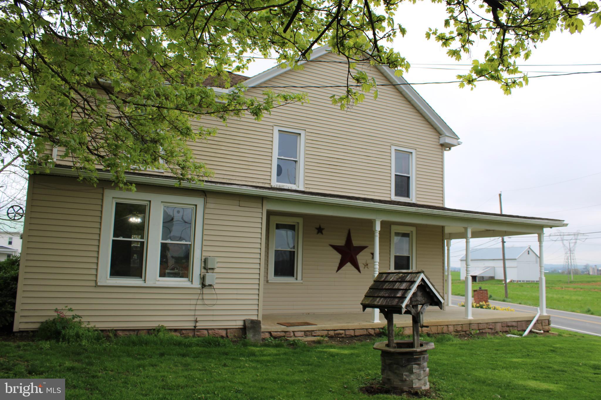 165 Short Road Stevens, PA 17578 - Photo 5 of 19 a front view of a house with garden