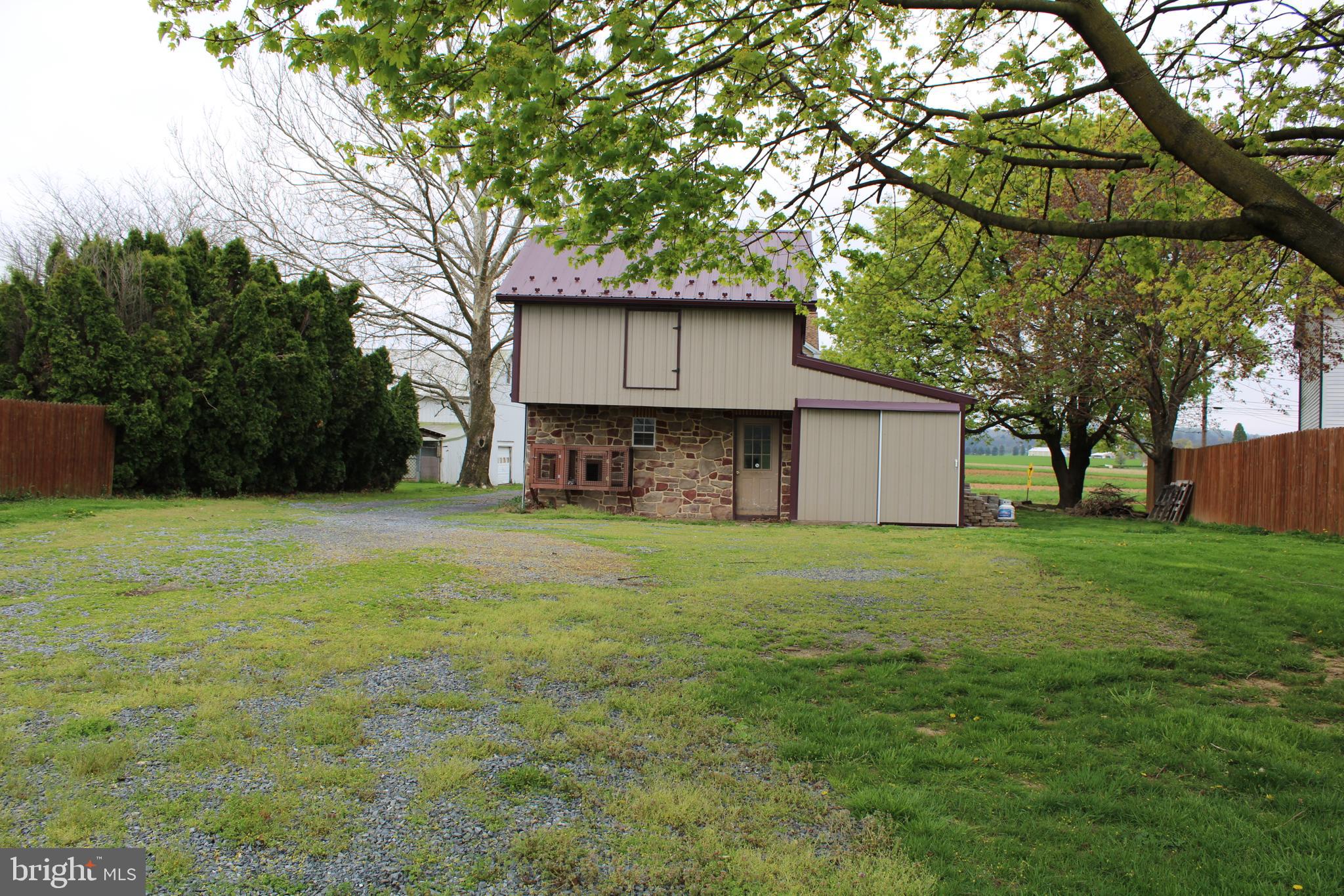 165 Short Road Stevens, PA 17578 - Photo 8 of 19 a front view of house with yard and trees