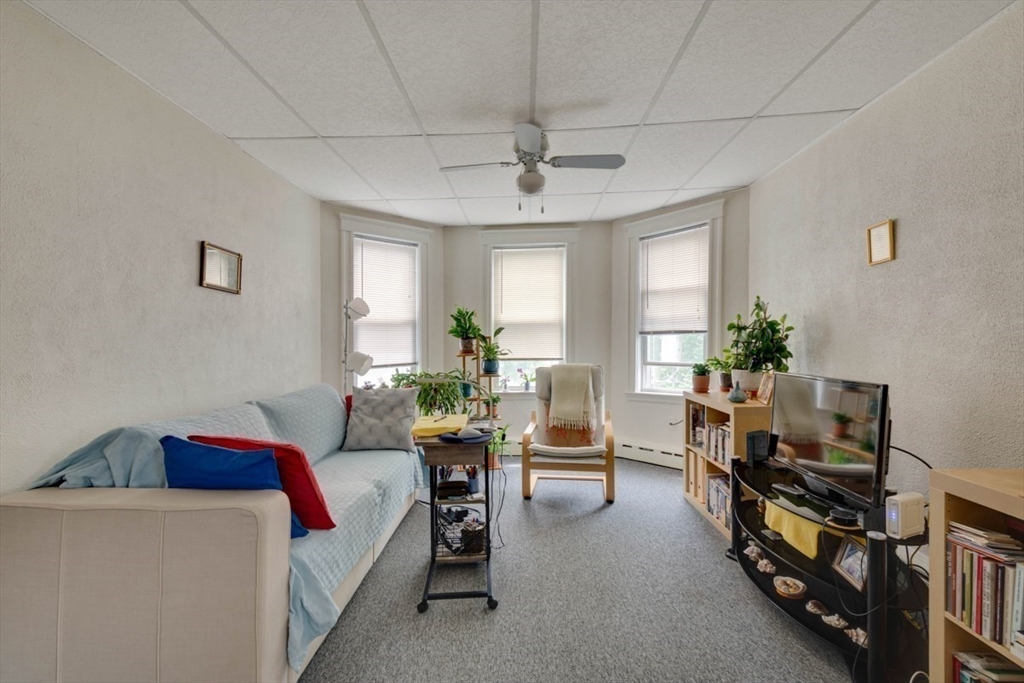 45 Jackson Road Somerville, MA 02145 - Photo 24 of 27 a living room with furniture and a window