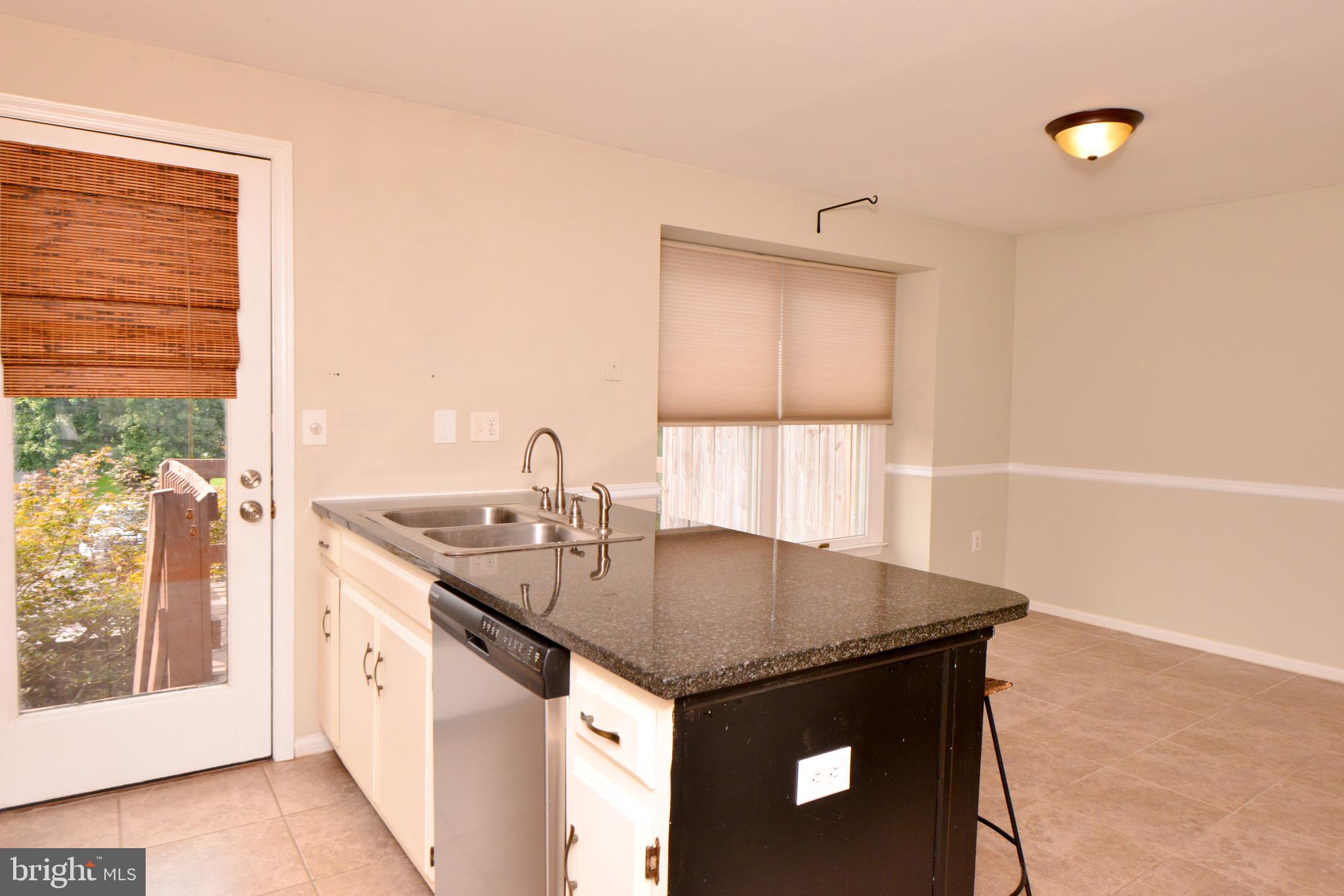 8013 Hollow Reed Court Frederick, MD 21701 - Photo 12 of 34 Kitchen with door to deck.