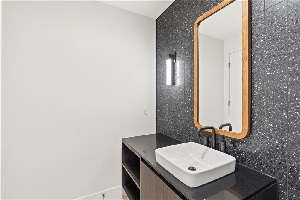 48 East Avenue, Unit 1503 Austin, TX 78701 - Photo 16 of 40 a bathroom with a sink and a mirror