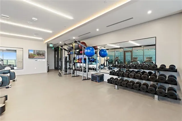 a living room with lots of furniture and clutter