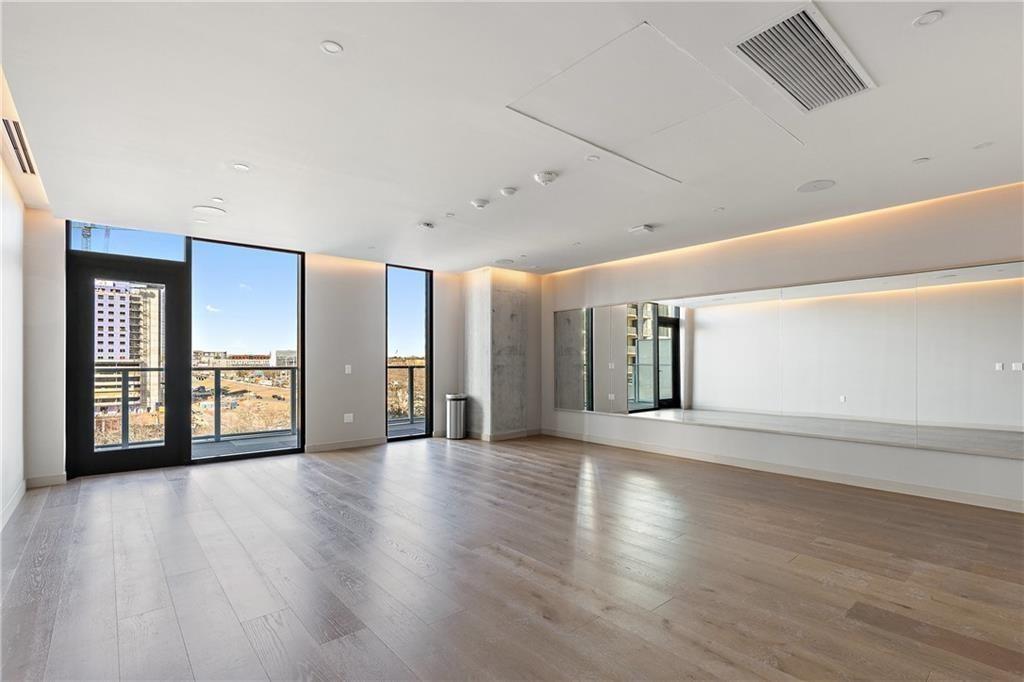 48 East Avenue, Unit 1503 Austin, TX 78701 - Photo 31 of 40 a view of an empty room with window and wooden floor