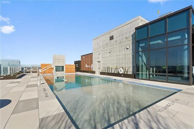 a view of a swimming pool with a lounge chair