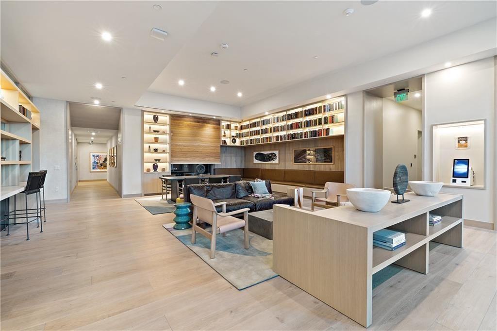 48 East Avenue, Unit 1503 Austin, TX 78701 - Photo 39 of 40 a living room with couches and kitchen view with wooden floor