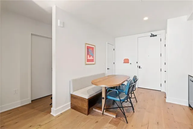a view of a room with furniture and wooden floor
