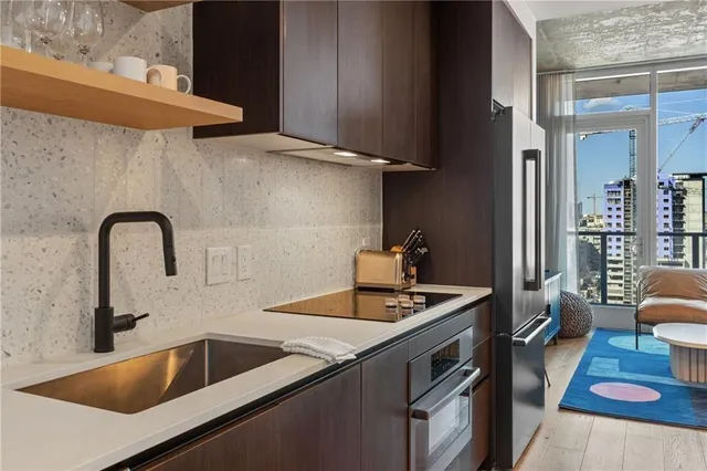 a kitchen that has a sink and a stove