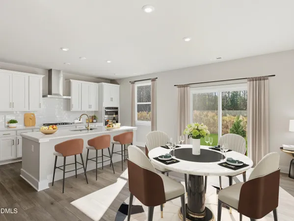 a view of kitchen with cabinets table and chairs