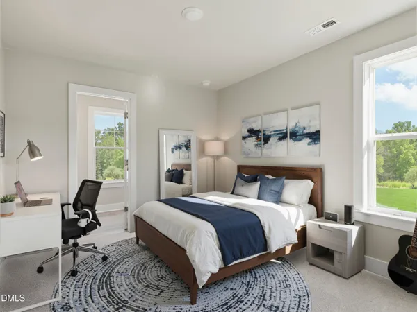 a living room with furniture and a large window with garden view