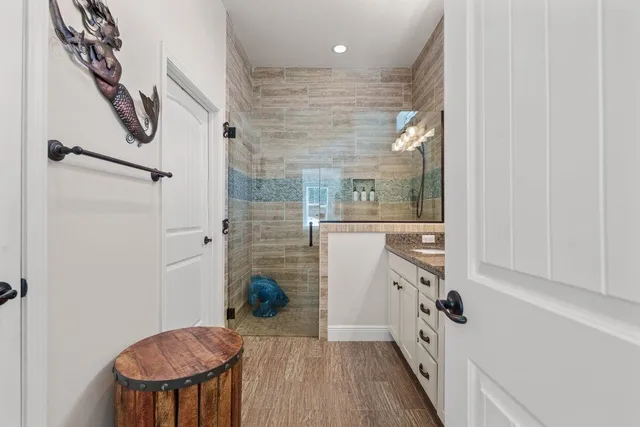 a bathroom with a bathtub and a shower