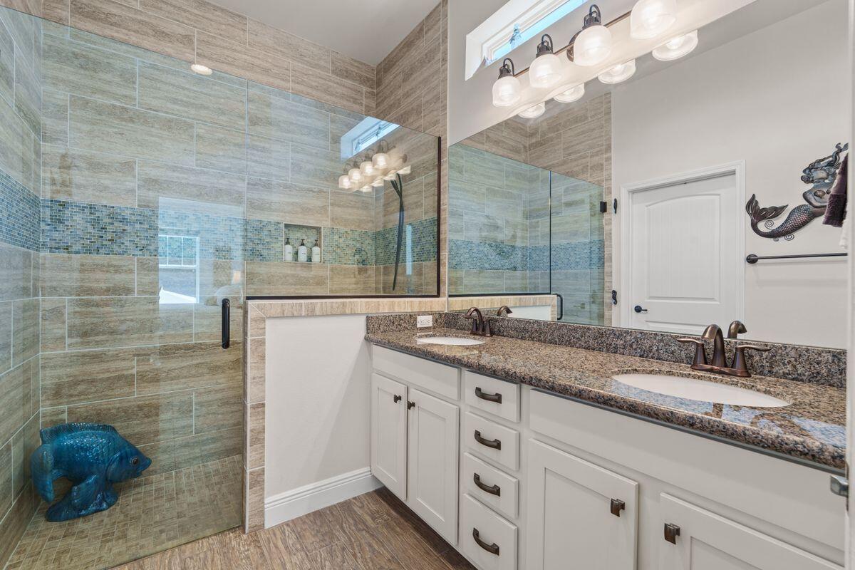 38 Inlet Cove Inlet Beach, FL 32461 - Photo 13 of 29 a bathroom with a granite countertop sink a mirror and a shower