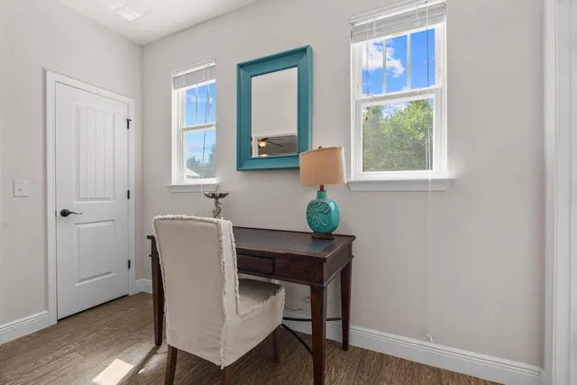 a workspace with furniture and window