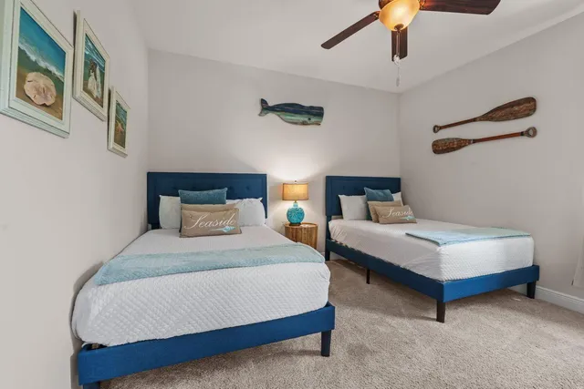 a bedroom with a bed lamp and furniture