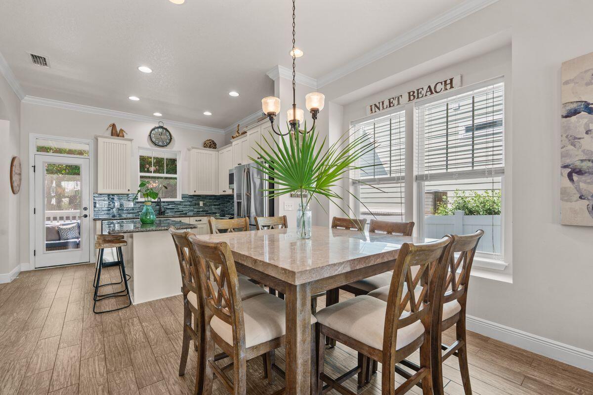 38 Inlet Cove Inlet Beach, FL 32461 - Photo 7 of 29 a dining room with furniture potted plants and wooden floor