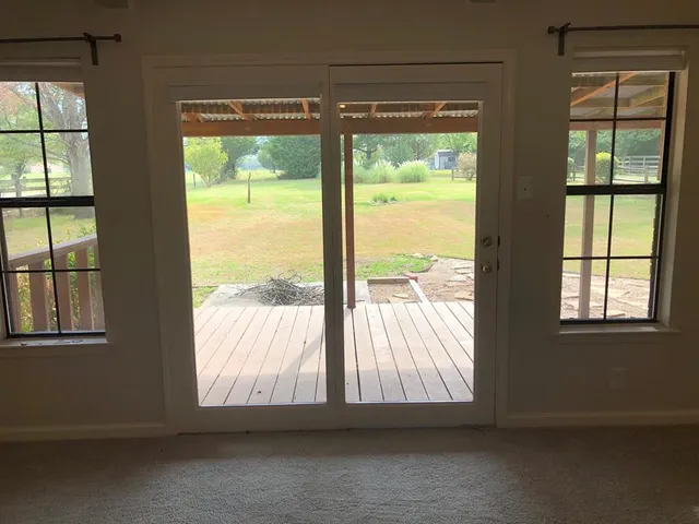 a view of an empty room and window
