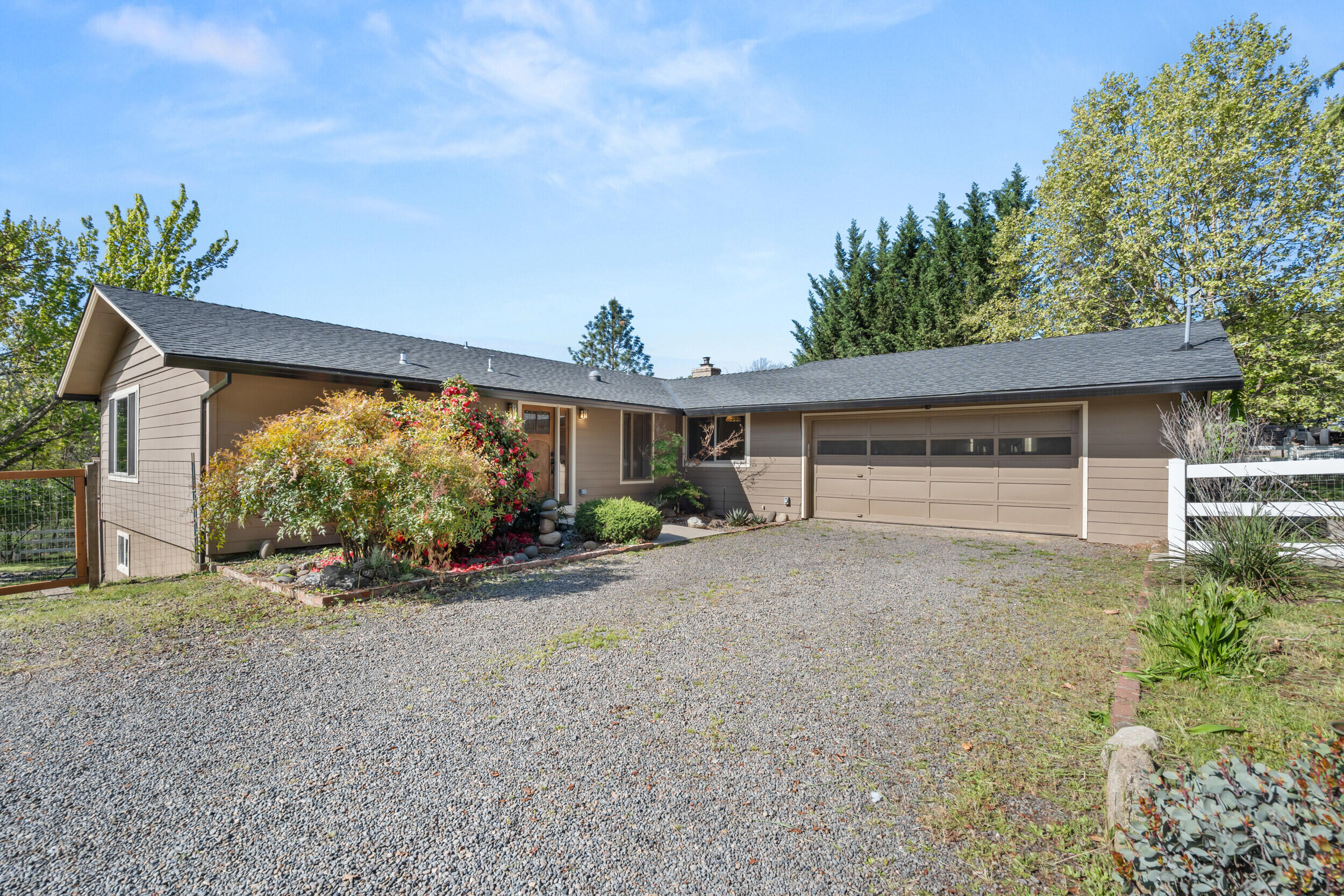 3583 Ross Lane Central Point, OR 97502 - Photo 30 of 52 front view of a house with a yard and potted plants