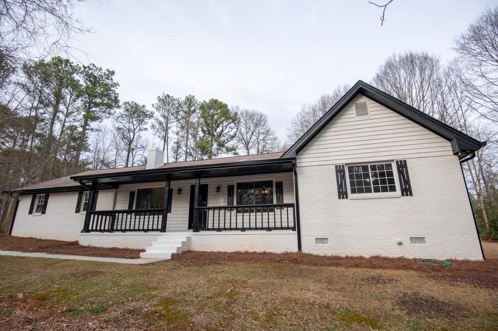 3598 High Ridge Drive Southwest Conyers, GA 30094 - Photo 1 of 1 a front view of a house with a porch