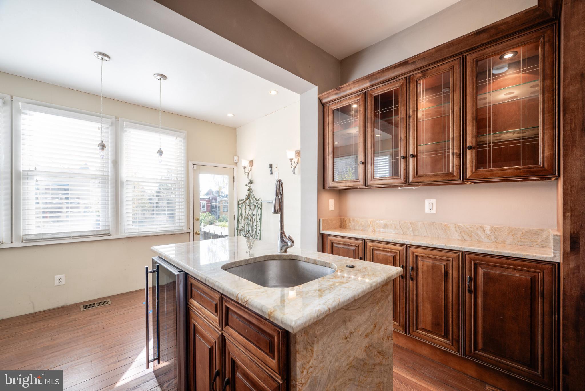 118 Bryant Street Northwest Washington, DC 20001 - Photo 13 of 49 Elegant kitchen with rich wood accents.