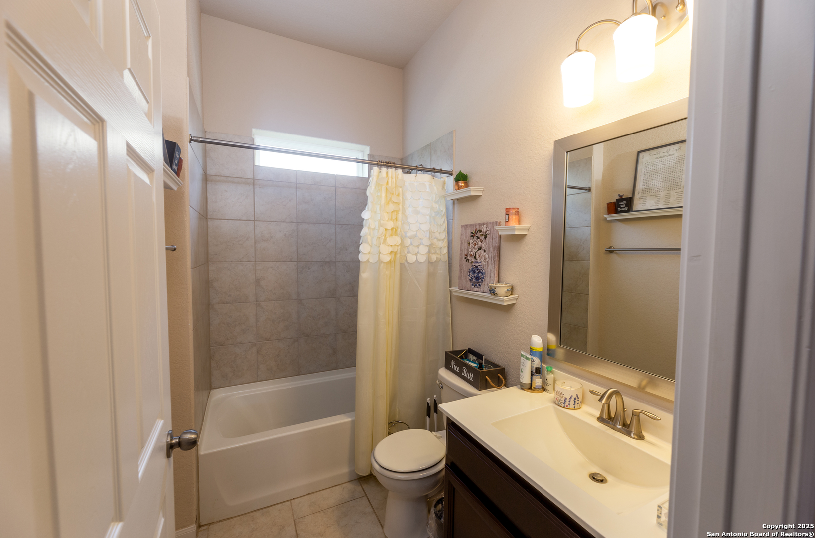 8701 Stackstone Schertz, TX 78154 - Photo 14 of 25 a bathroom with a sink a toilet and shower