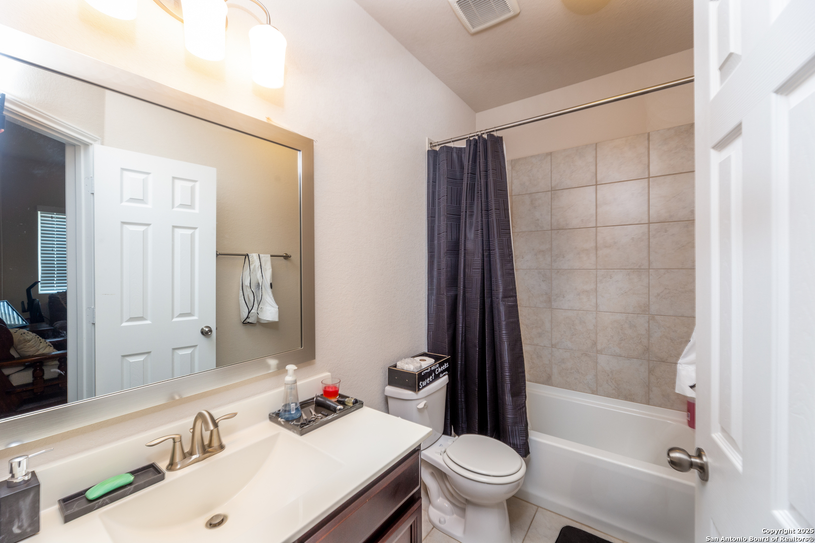 8701 Stackstone Schertz, TX 78154 - Photo 16 of 25 a bathroom with a sink toilet vanity and shower