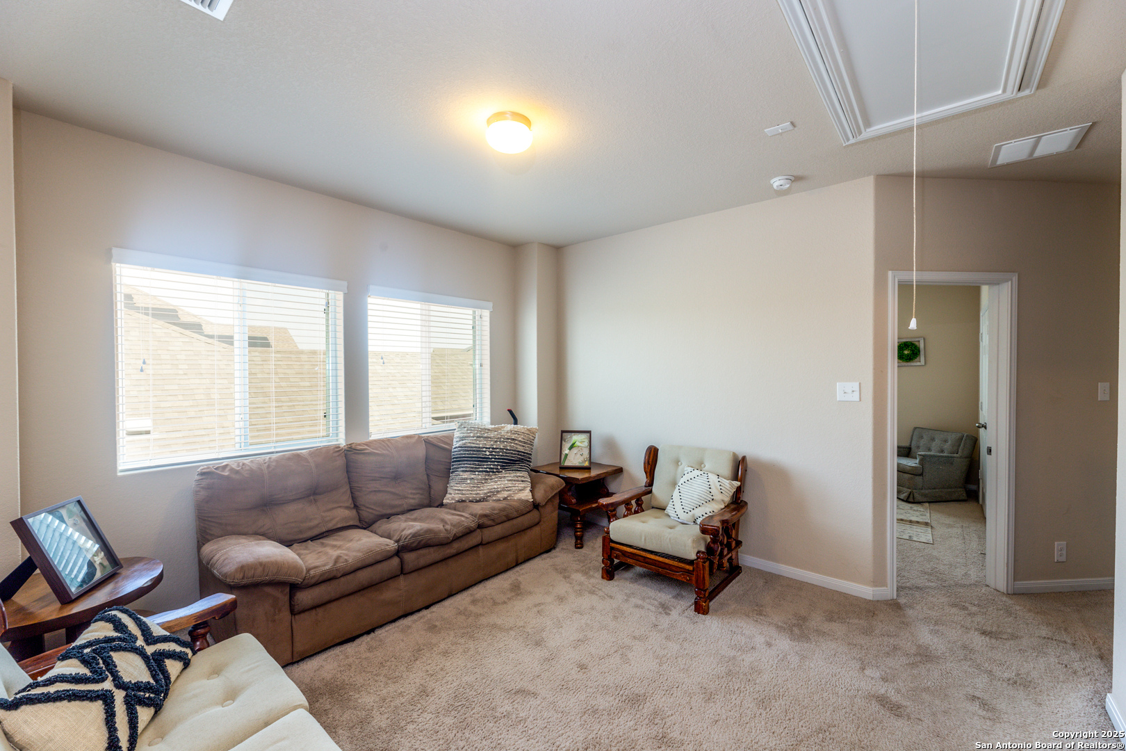 8701 Stackstone Schertz, TX 78154 - Photo 17 of 25 a living room with furniture and a large window