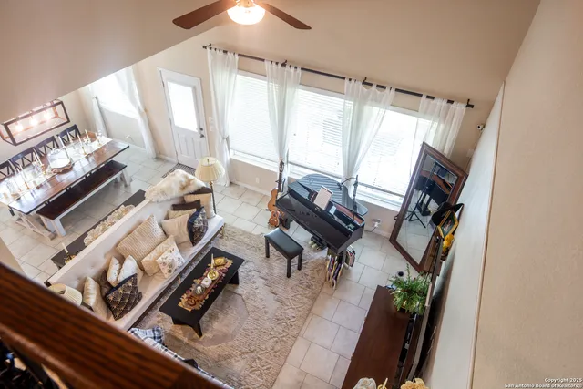a view of living room with furniture and a fireplace