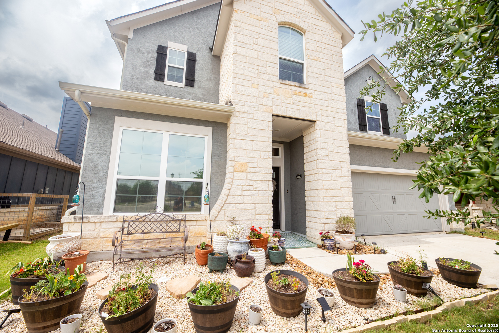 8701 Stackstone Schertz, TX 78154 - Photo 2 of 25 a view of a patio with couches chairs and potted plants