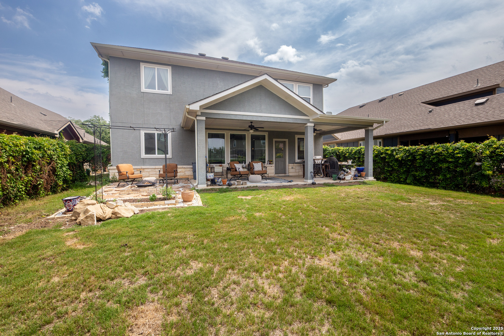 8701 Stackstone Schertz, TX 78154 - Photo 21 of 25 a front view of house with yard and outdoor seating