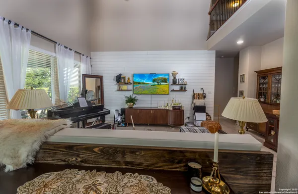 a living room with furniture rug and window