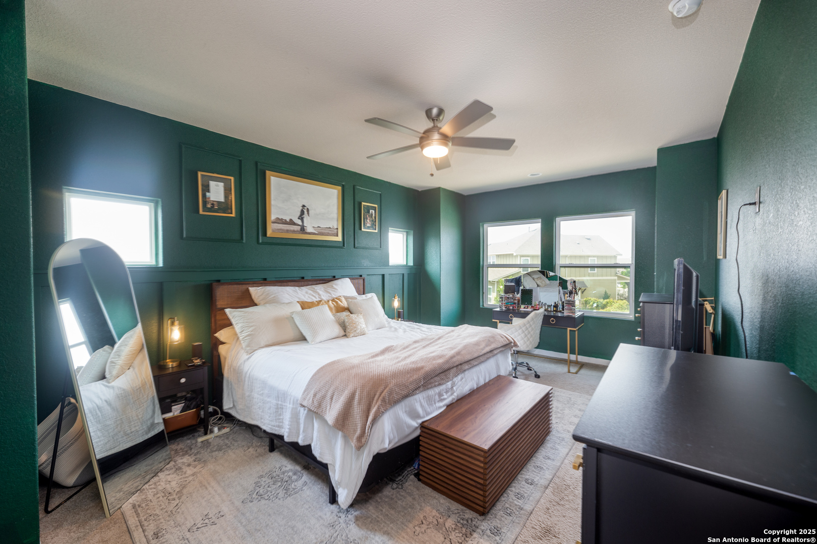 8701 Stackstone Schertz, TX 78154 - Photo 8 of 25 a bedroom with a large bed and a chandelier