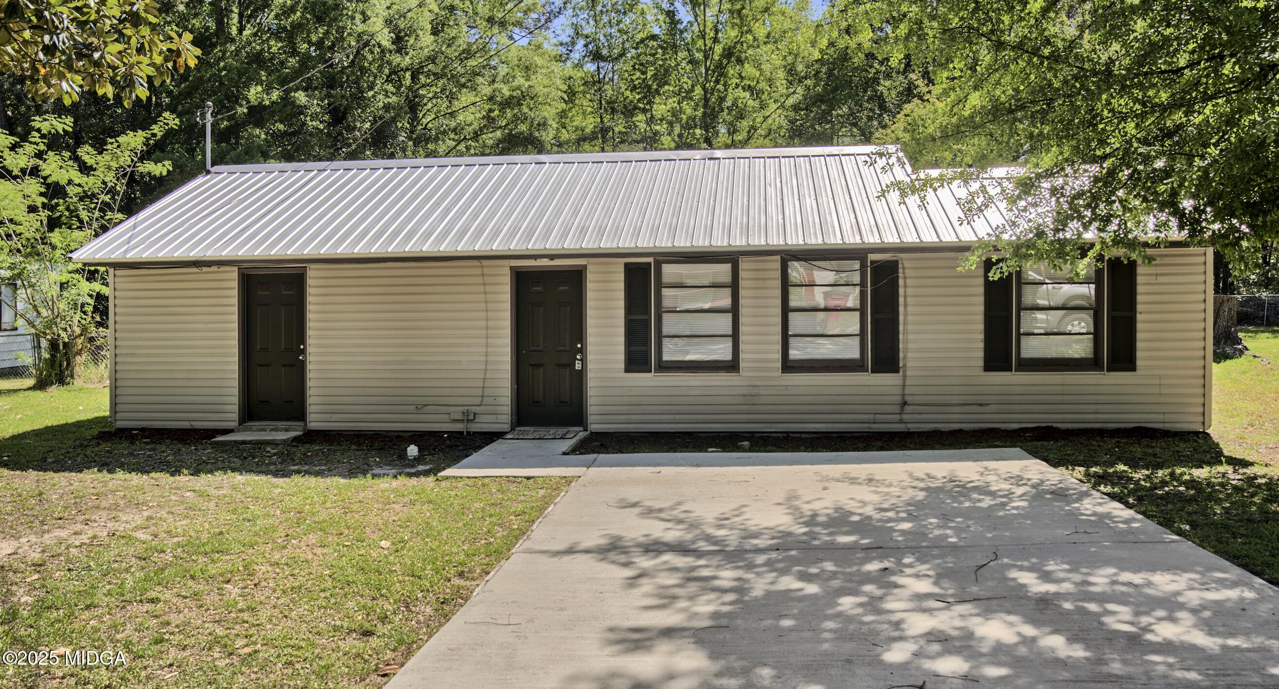 3979 Spencer Circle Macon, GA 31206 - Photo 1 of 14 a view of a house with a yard