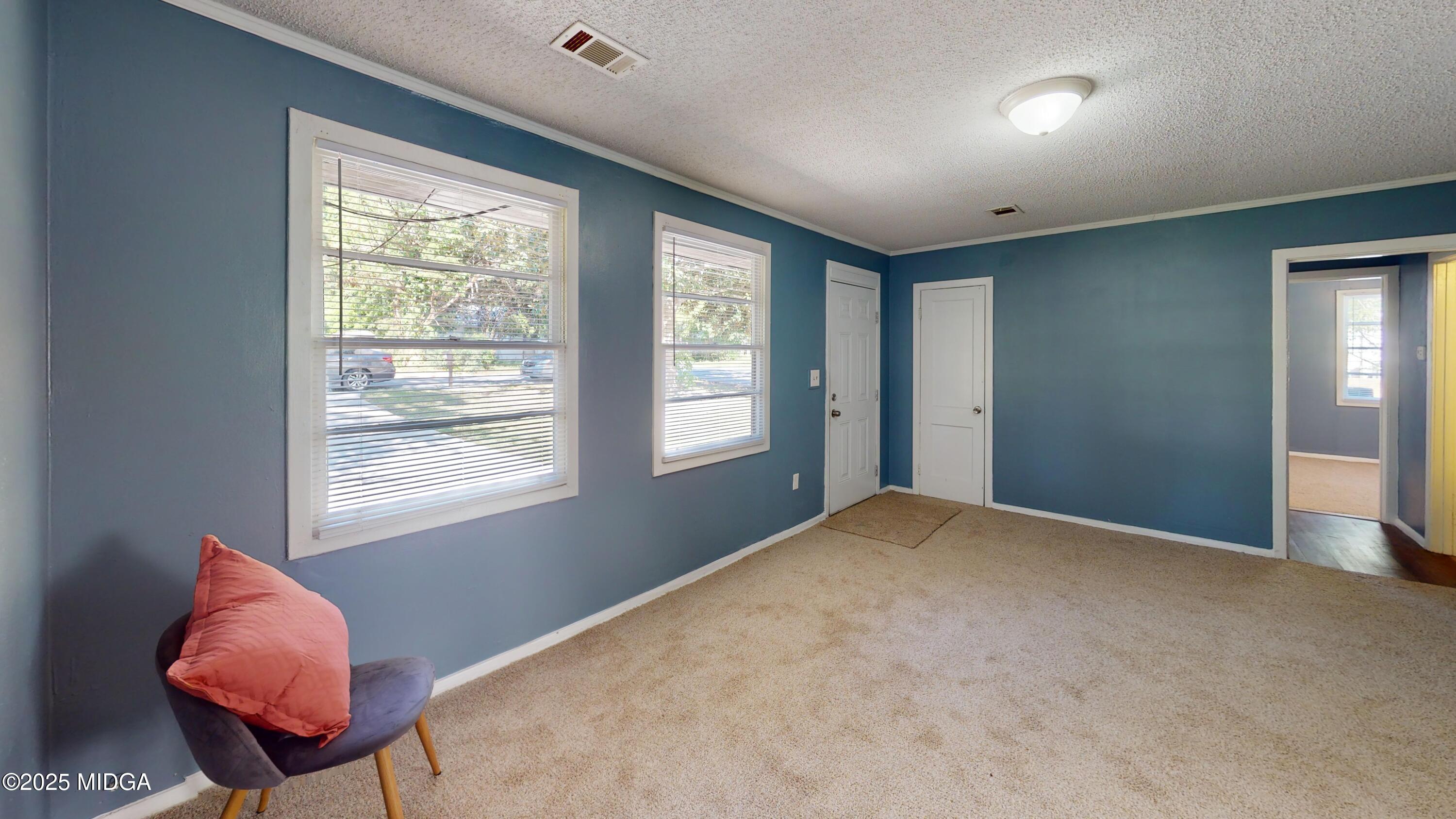 3979 Spencer Circle Macon, GA 31206 - Photo 12 of 14 a view of an empty room with a window and a chair